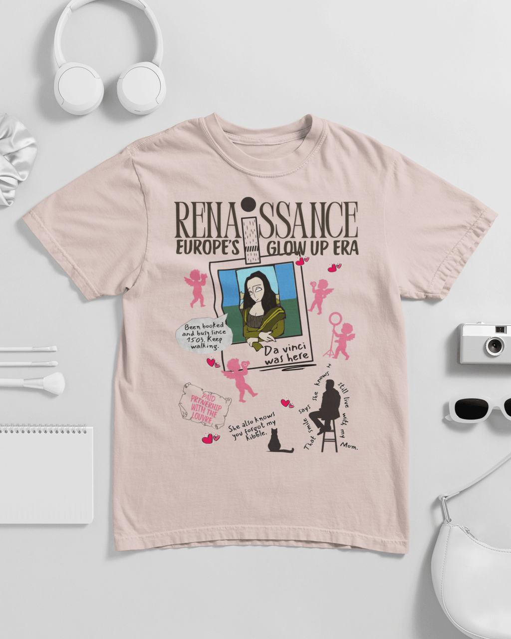 Beige t-shirt with graphic design and text on a light gray background