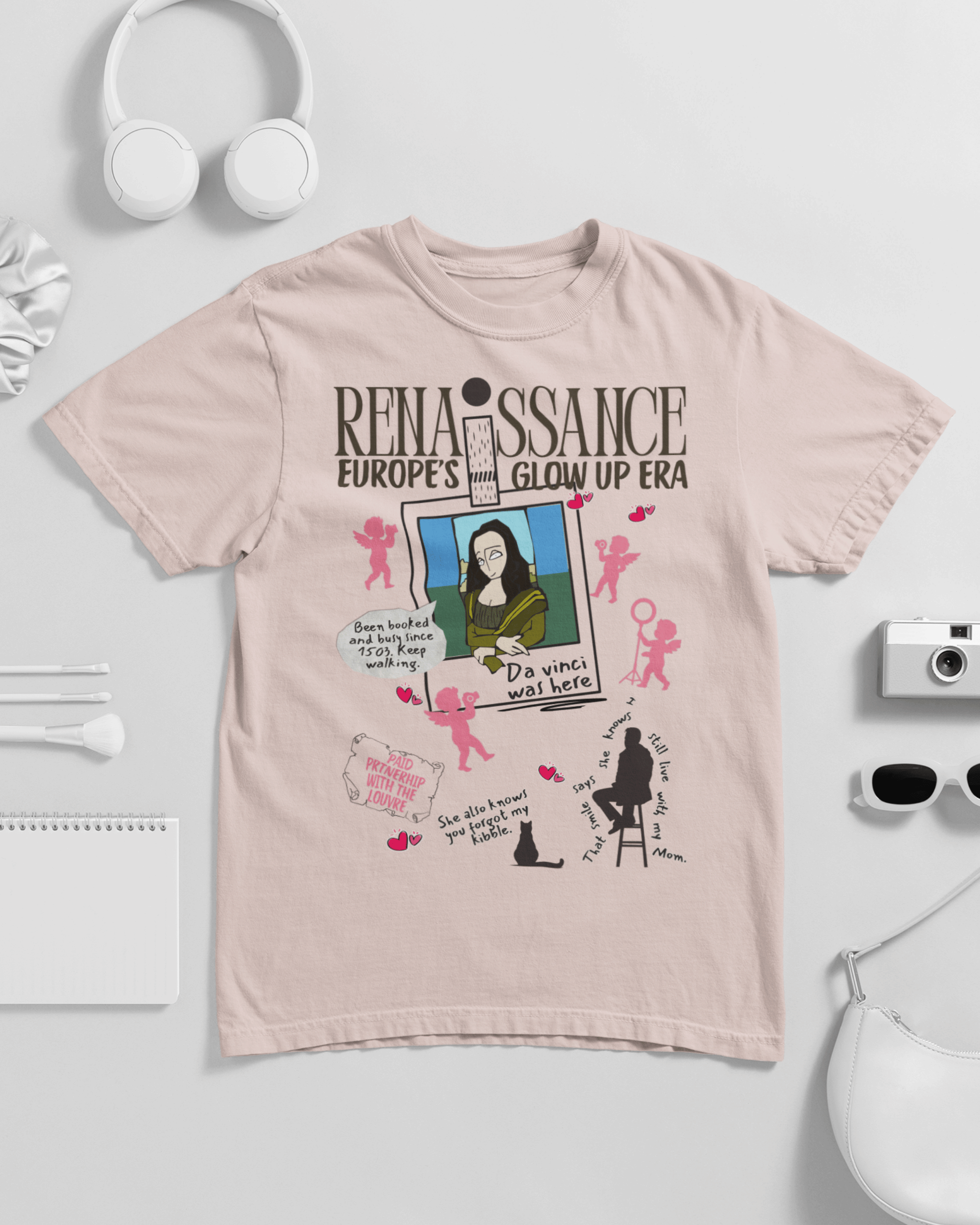 Beige t-shirt with graphic design and text on a light gray background